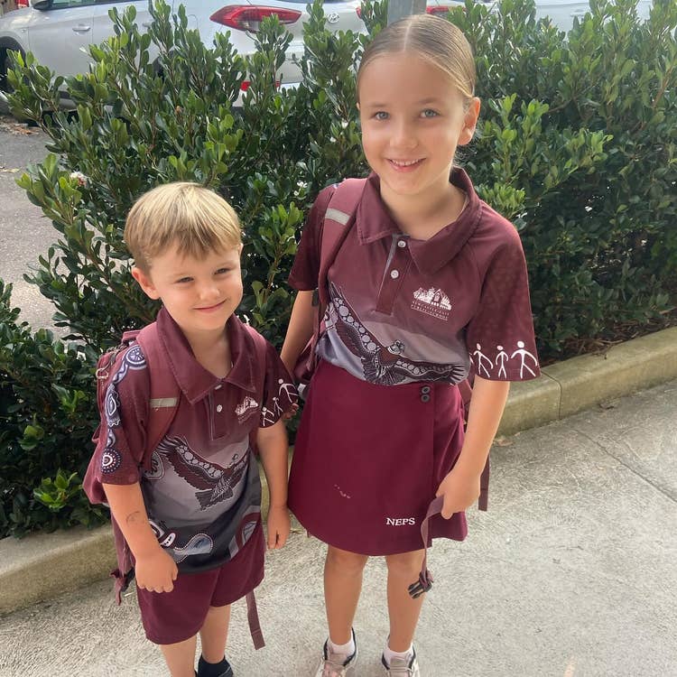 Students in school uniforms smiling